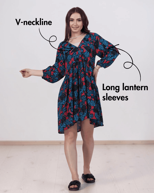 Woman wearing floral boho dress with V-neck and long lantern sleeves, sewing pattern 'Ivy'