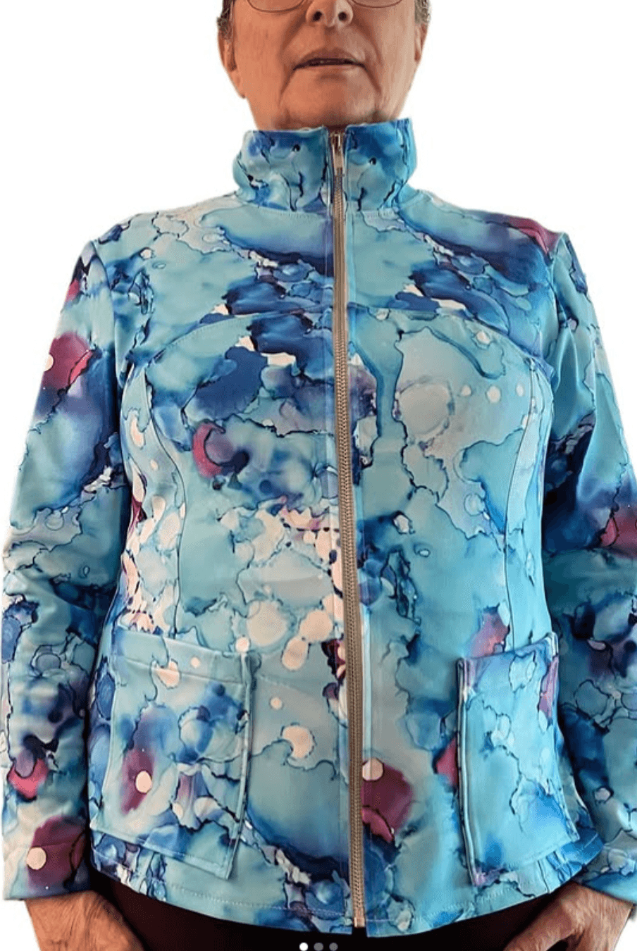 Woman in purple sports jacket with thumbhole cuffs, front view