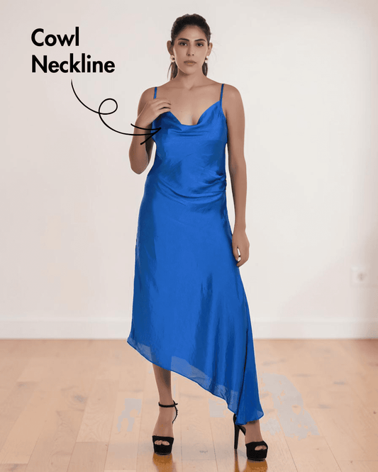 Model wearing blue satin maxi dress with cowl neckline and asymmetric hem
