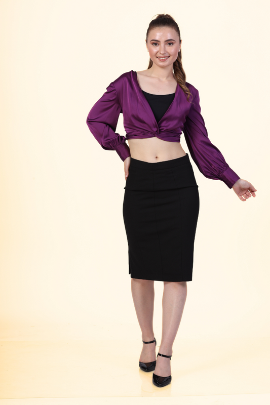 Model wearing the Front Knot Top 'Willow' in purple satin, paired with a black pencil skirt. A chic and versatile sewing pattern for stylish outfits.