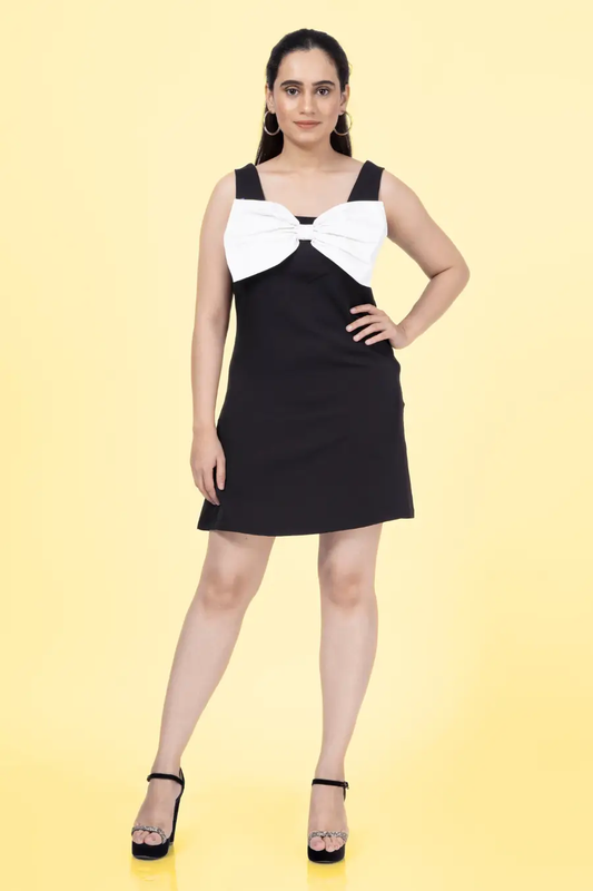 a woman in a black and white dress made with Phoebe big bow dress sewing pattern