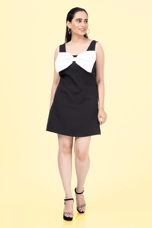 a woman in a black and white dress