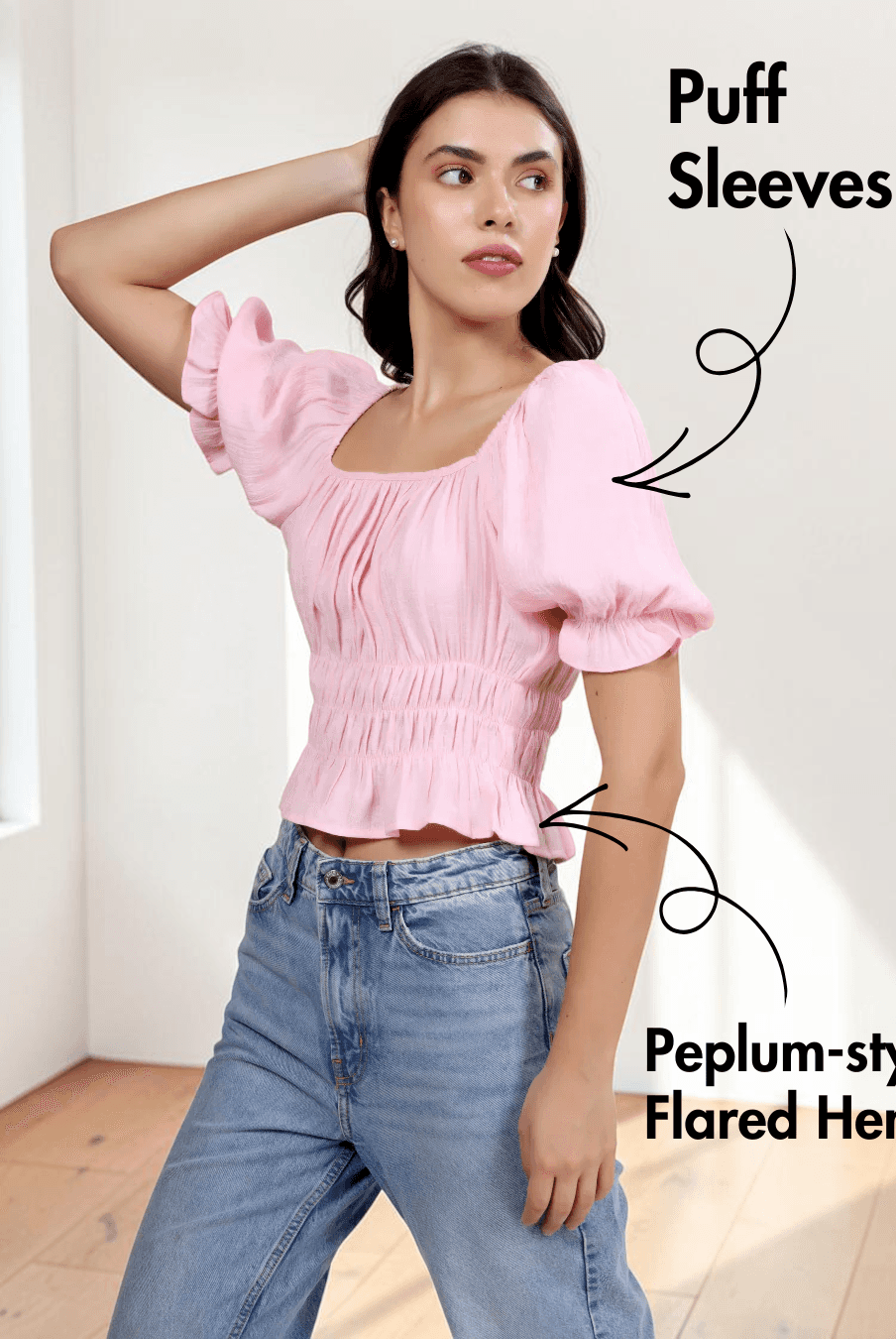 Close-up of pink cottagecore top with puff sleeves, ruched bodice, and flared hem