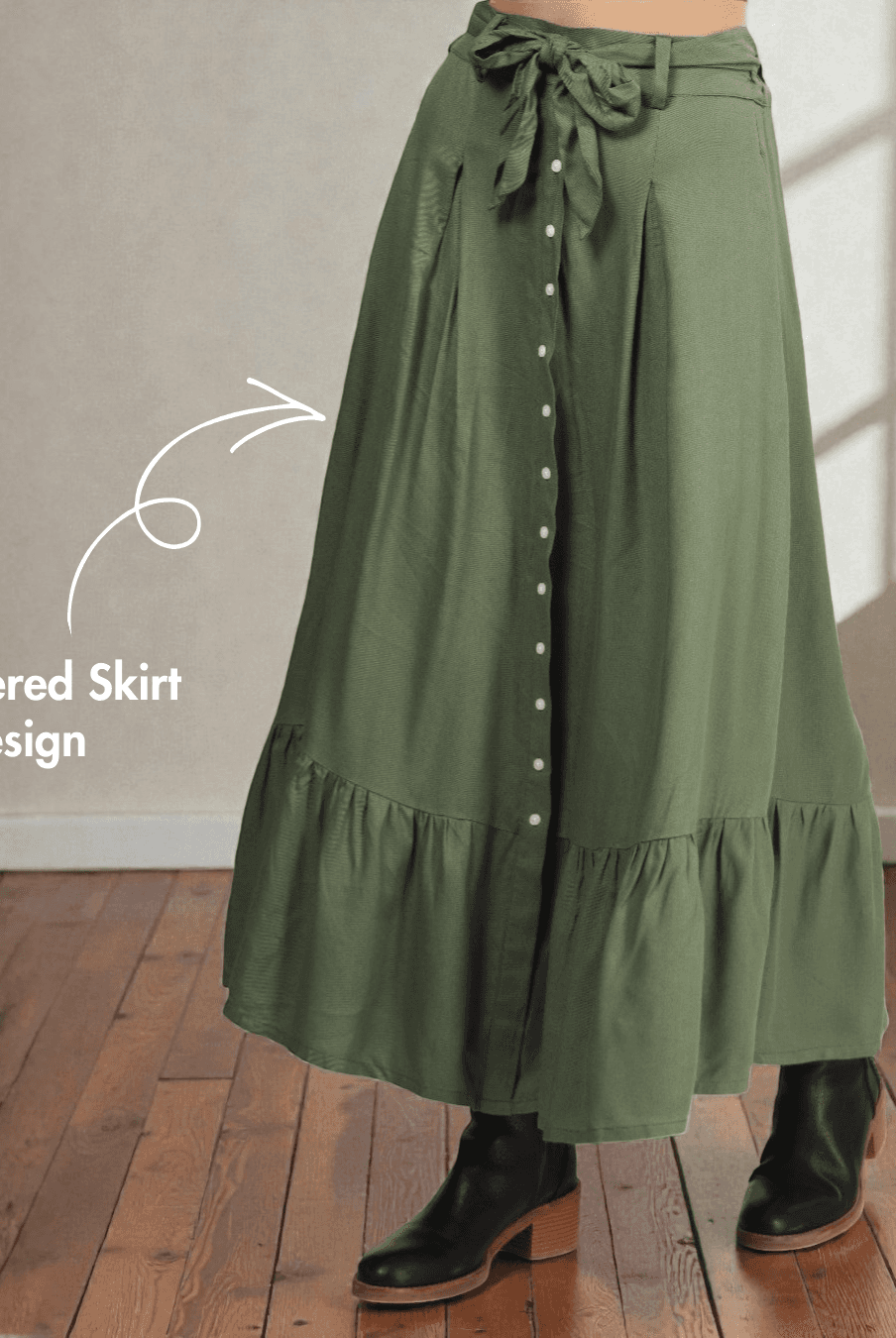 Close-up of tiered skirt design with decorative button placket and pleats from the 'Maple' cottagecore maxi skirt sewing pattern.