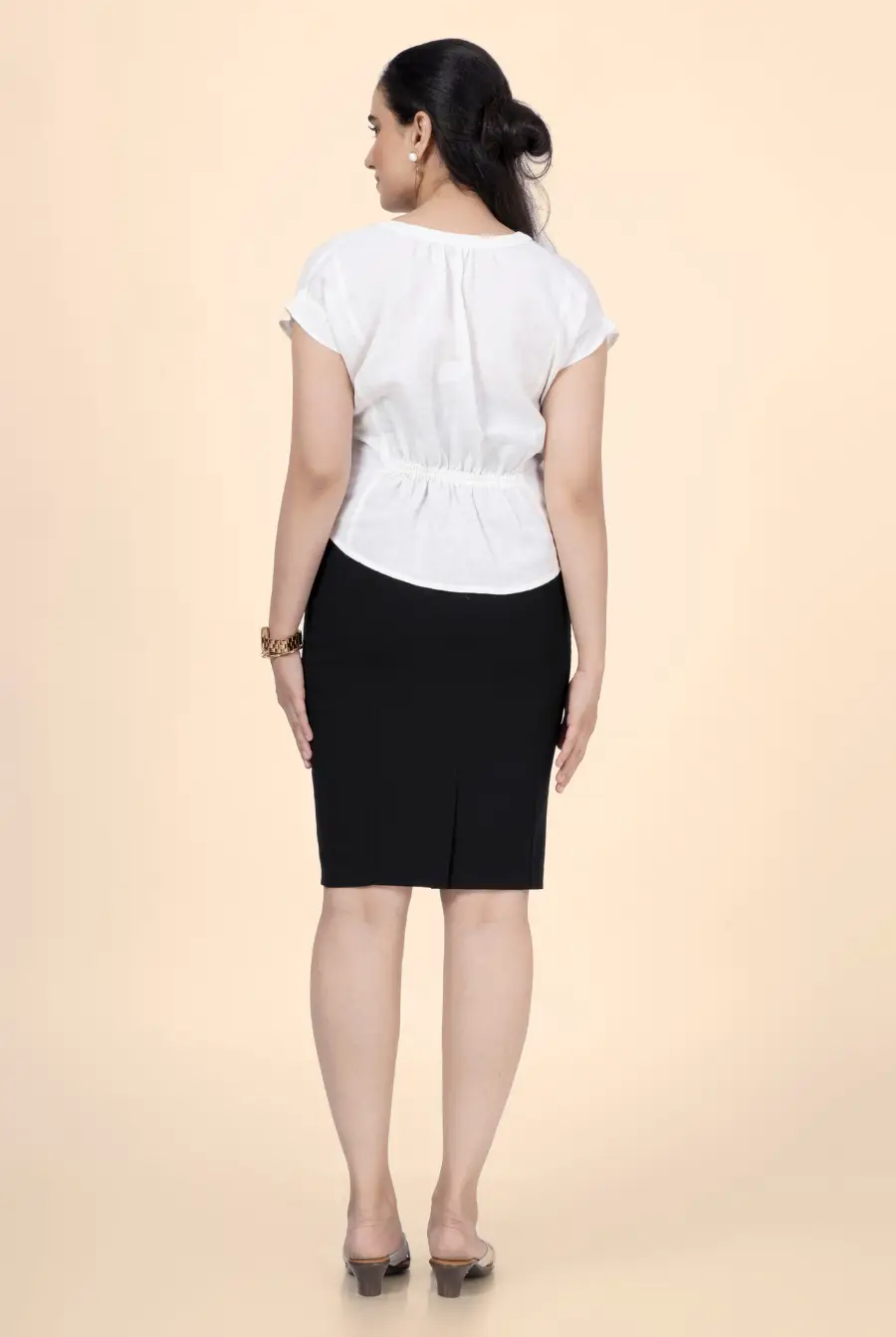 Back view of the short sleeve blouse from the 'Bliss' sewing pattern, showing an elasticated waist detail. A comfortable and stylish DIY sewing project.
