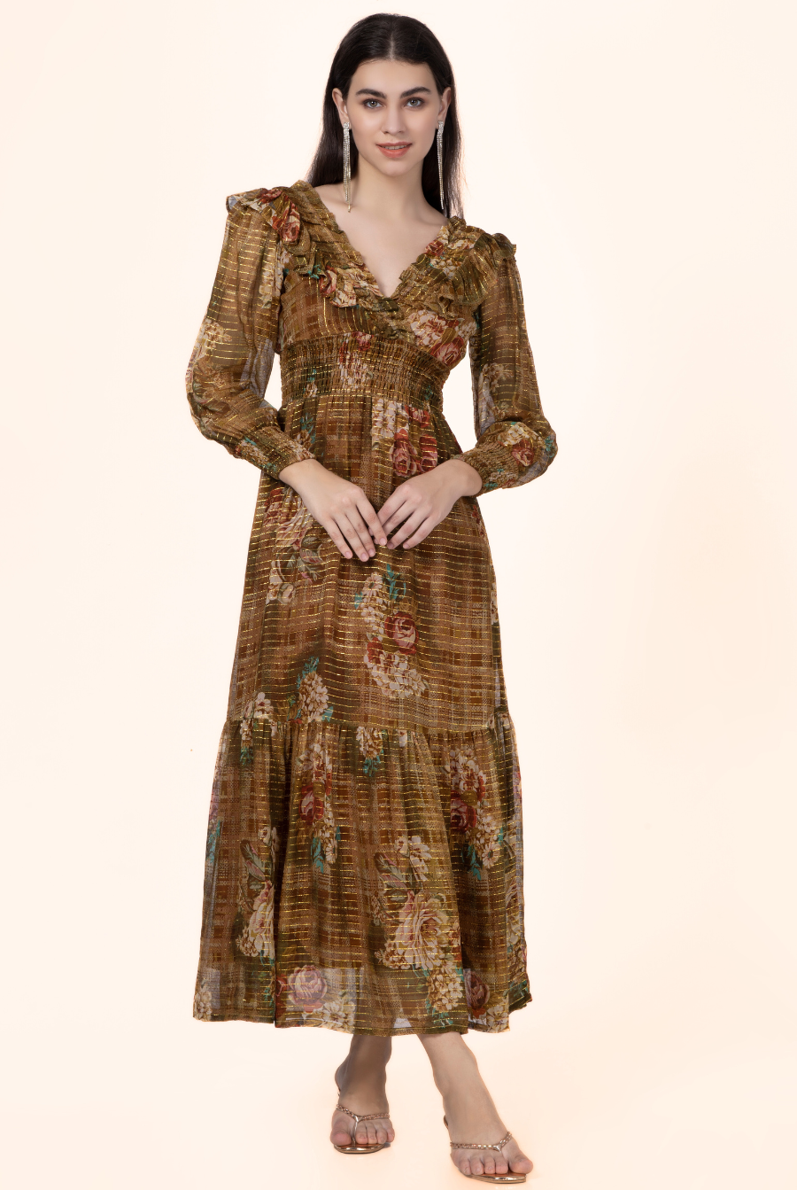 Model wearing a vintage-inspired Daisy Maxi Dress with a floral print, V-neckline, and shirred waist. Perfect for sewing enthusiasts.