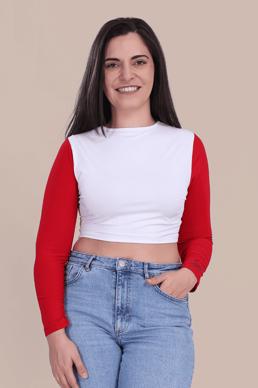 Women's long sleeve crop top in white with red sleeves, made using the Stella PDF sewing pattern. Perfect for knit fabrics and casual loungewear.