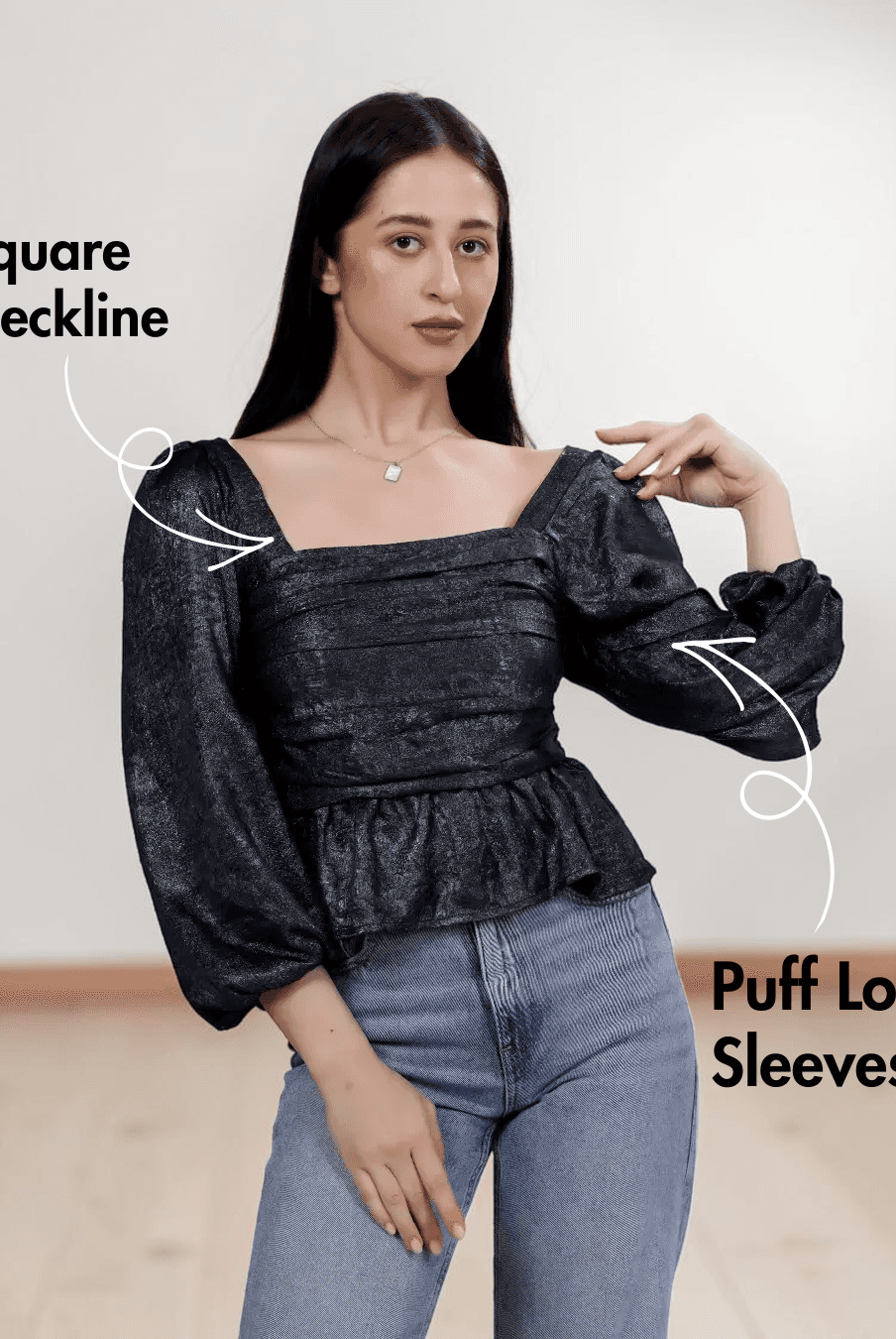 Women's black gathered peplum hem sewing pattern with smocked back and puff long sleeves, front view