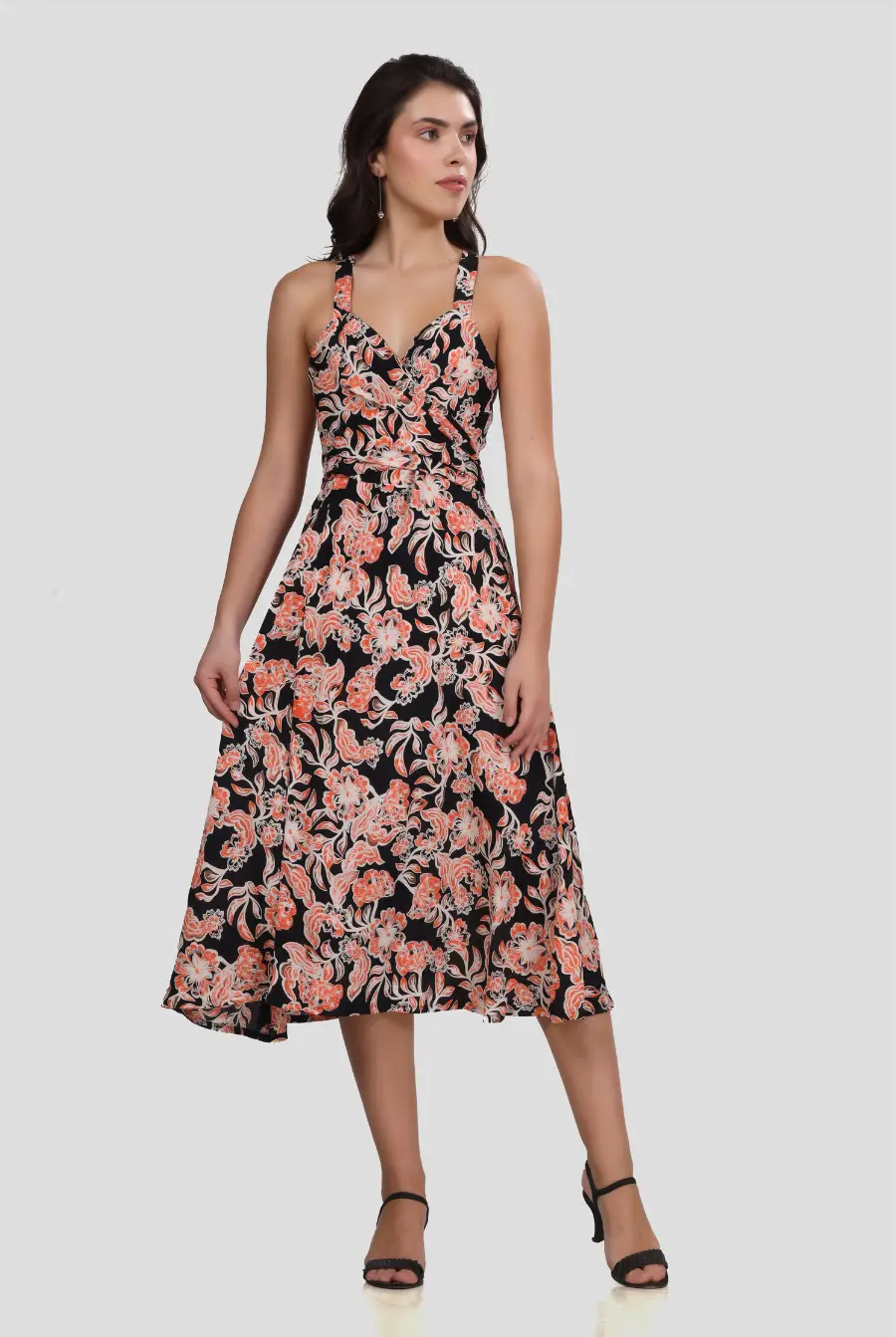 Full-length front view of the 'Camellia' wrap dress with a fitted bodice and flowing skirt. The floral print and wrap design offer a stylish look.