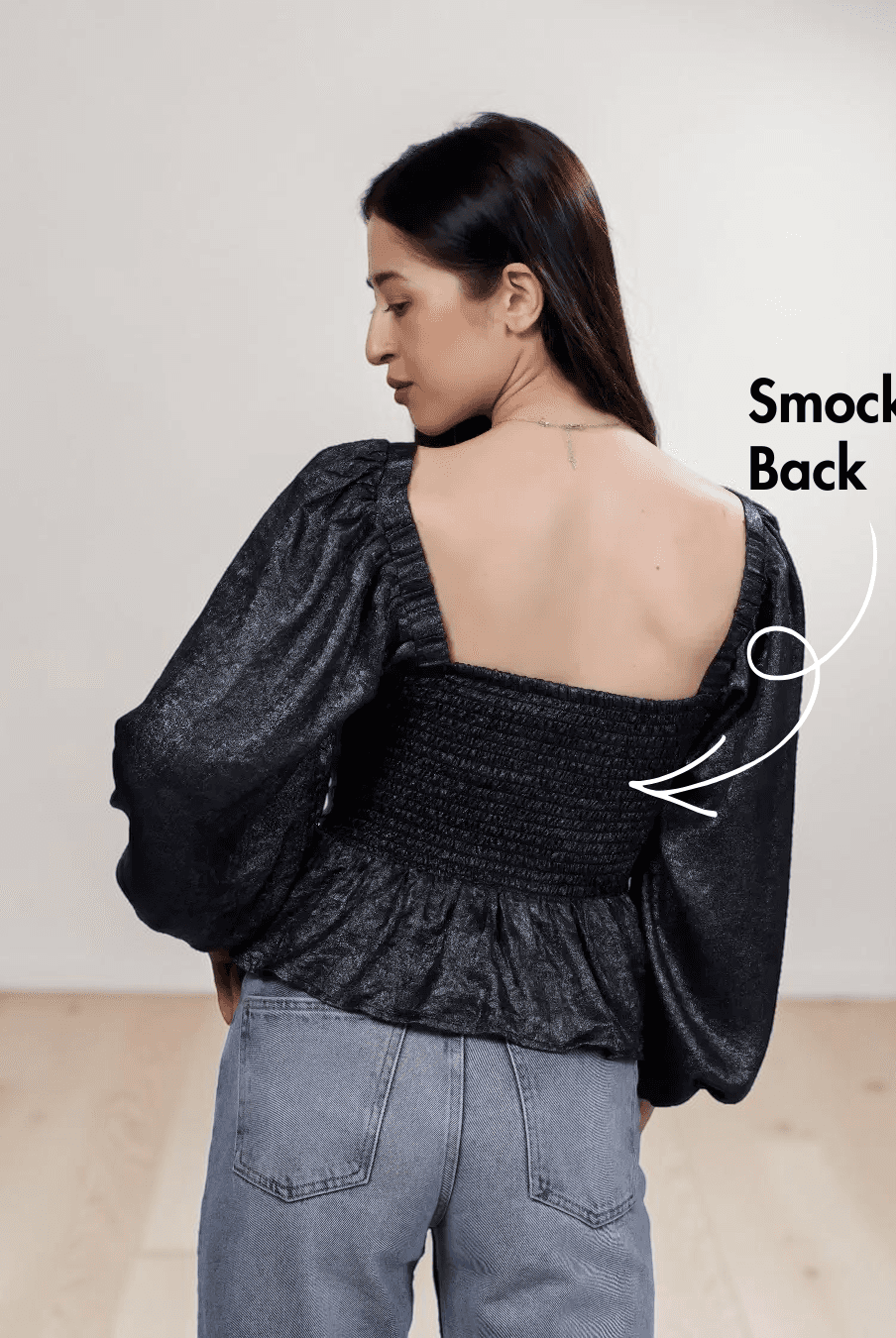 Women's black peplum top sewing pattern with square neckline and puff long sleeves, back view