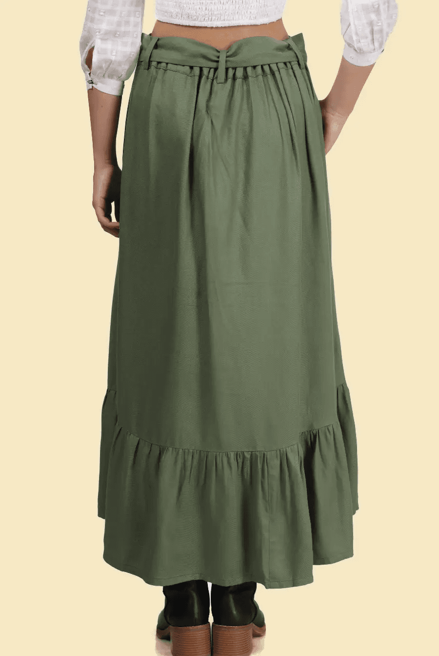Back view of a tiered maxi skirt with a gathered waistband and ruffled hem. The flowy design offers comfort and elegance.