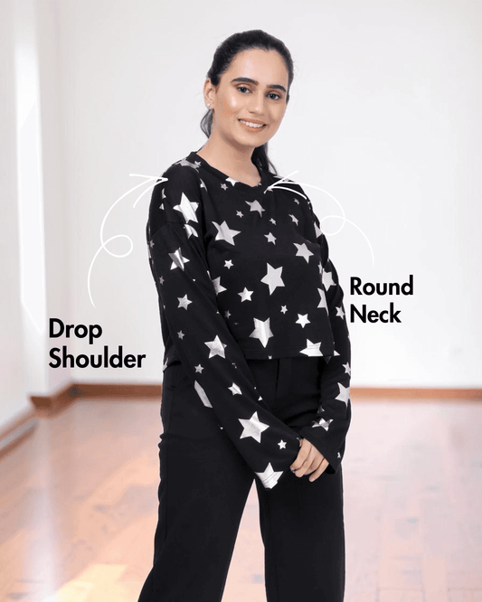 Back view of woman in star-patterned sweatshirt, long sleeves, relaxed fit, sewing pattern details