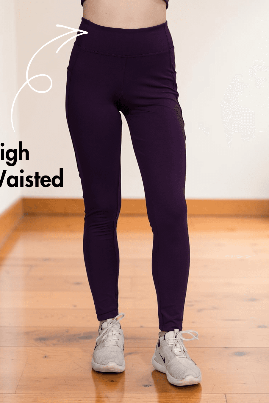 Close-up of purple high-waisted leggings with supportive waistband