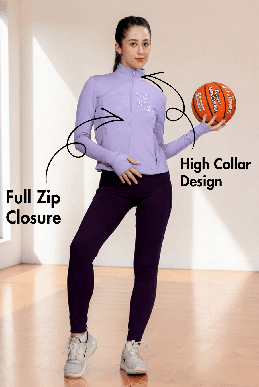 Close-up of women's purple sports jacket with high collar and full zip closure