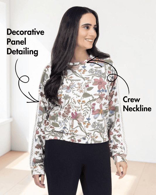 Front view of floral sweatshirt with decorative panel detailing