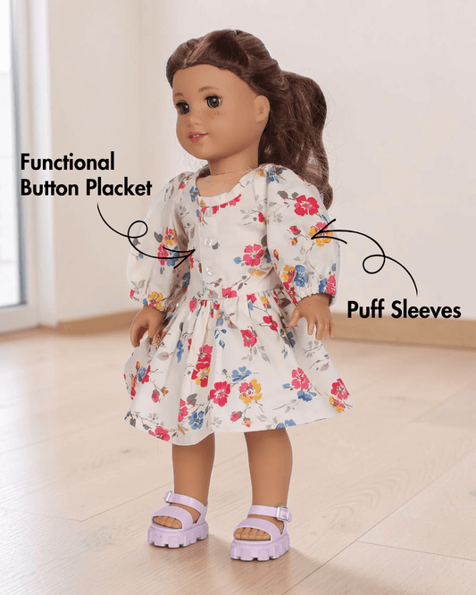 Side view of doll Millie in floral dress with elastic shirring and puff sleeves
