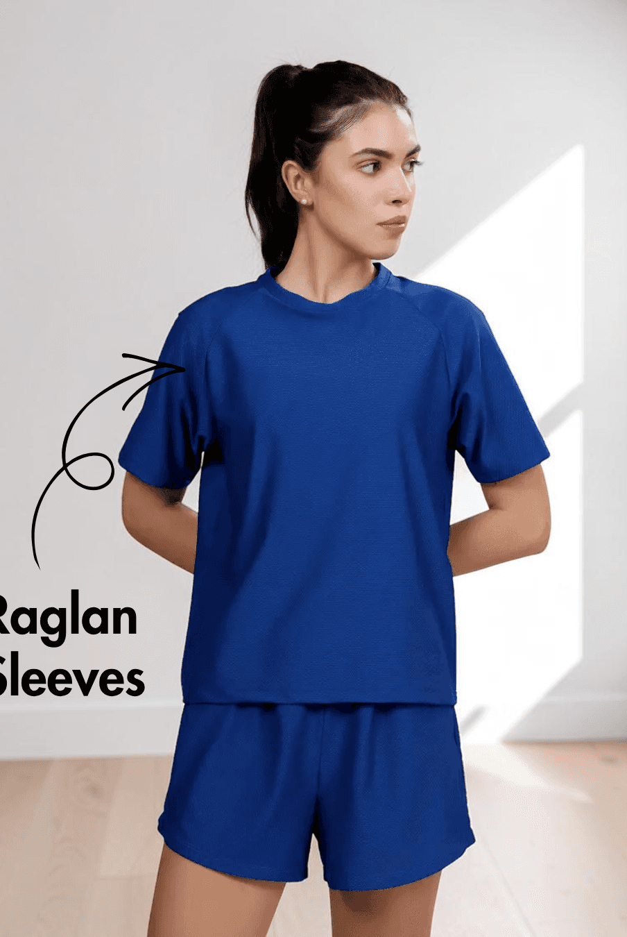 Blue women's activewear T-shirt with raglan sleeves and relaxed fit, suitable for sewing patterns