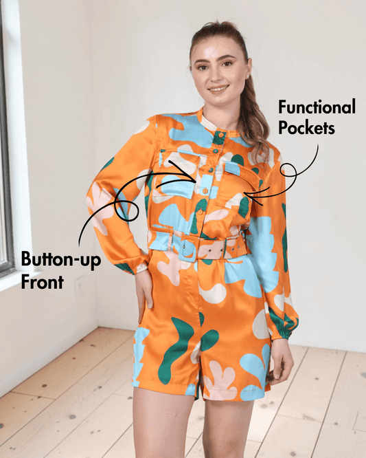 Model wearing floral playsuit with matching belt and long sleeves