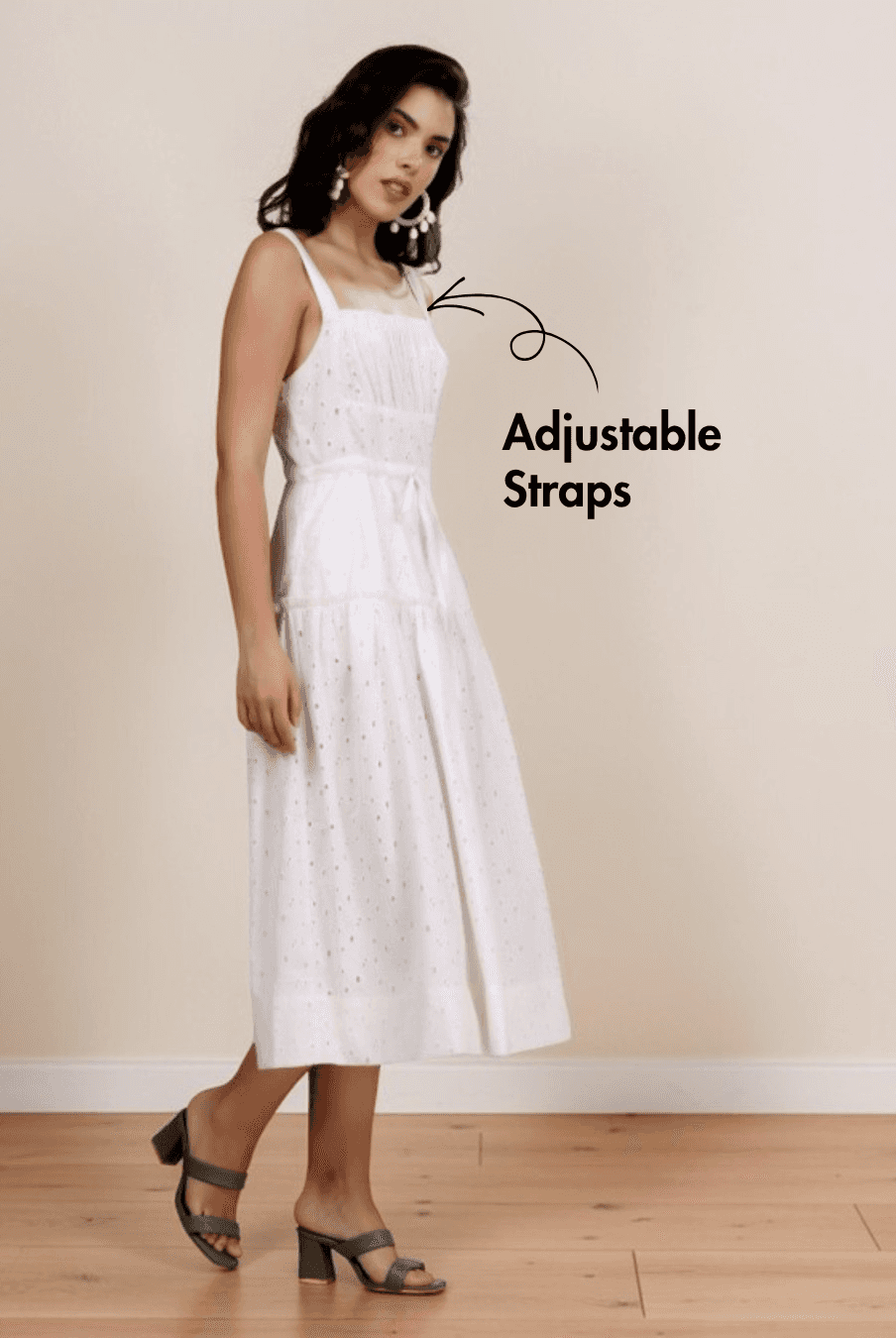 Model wearing white sundress with square neckline, adjustable straps, and side pockets, showcasing the Fiona sewing pattern