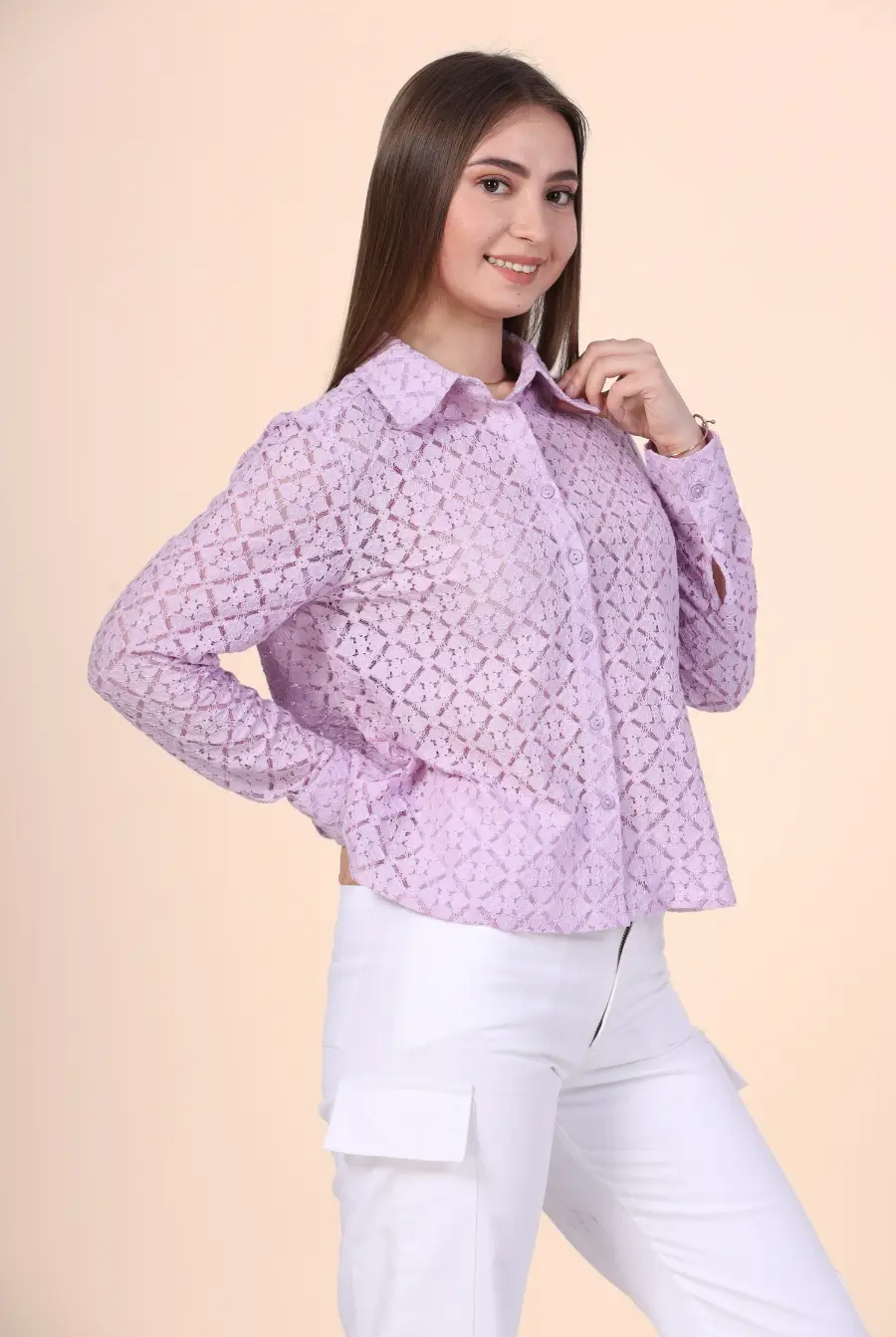 a woman in white pants and a purple shirt made from winslet's button down shirt sewing pattern