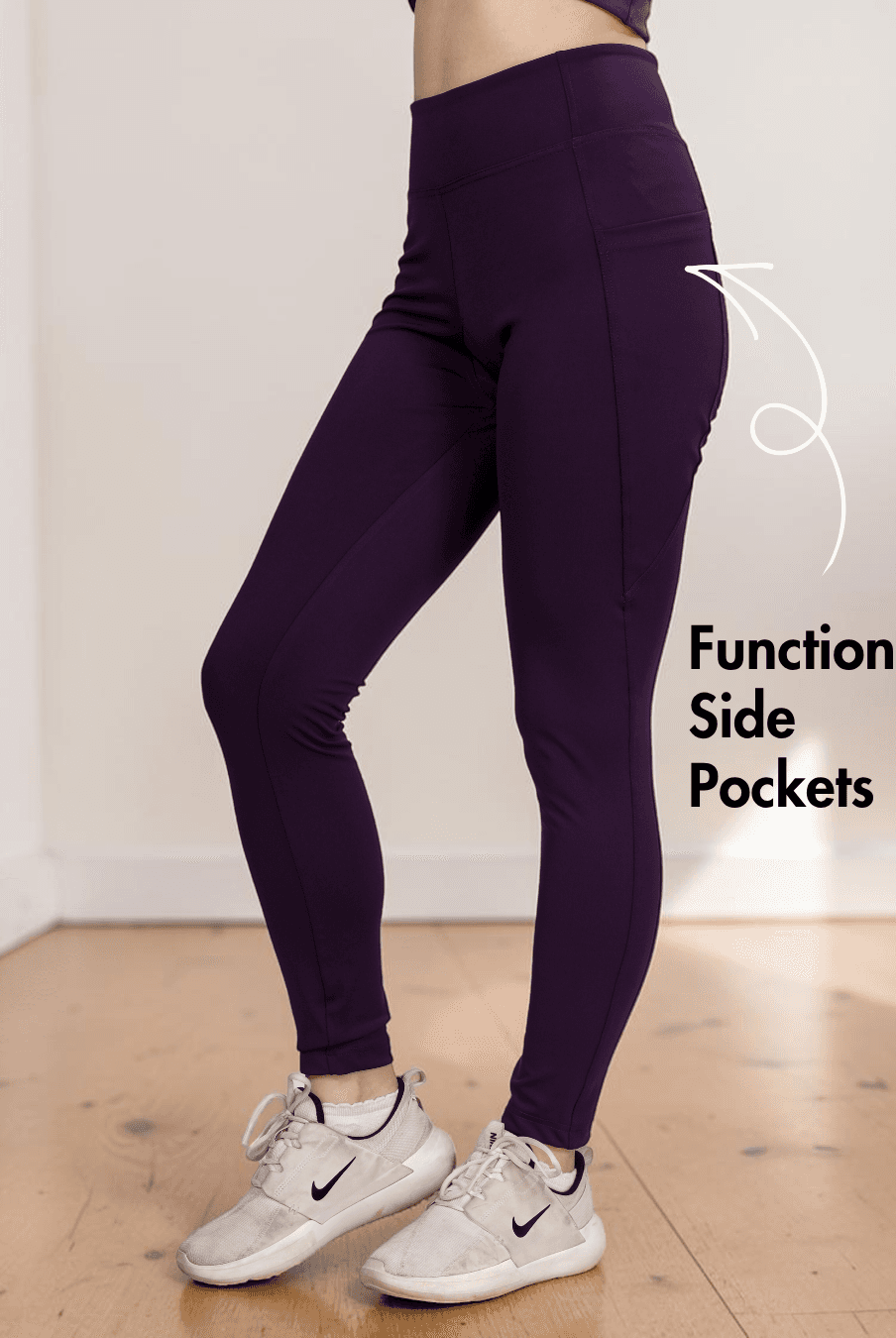 Back view of purple leggings highlighting supportive waistband and side pockets