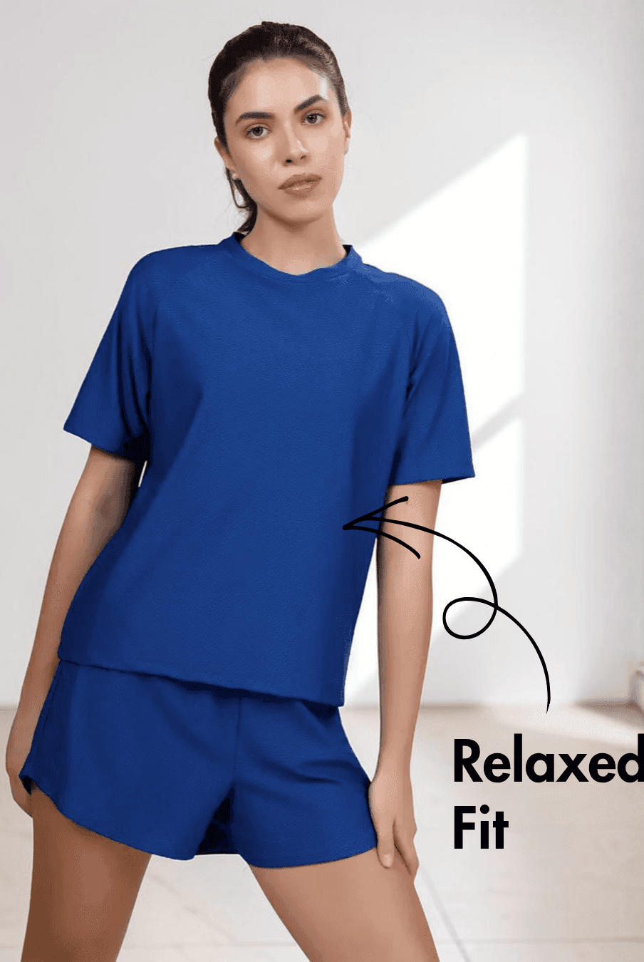 Close-up of blue women's T-shirt showing pattern details with mesh side panels for breathability