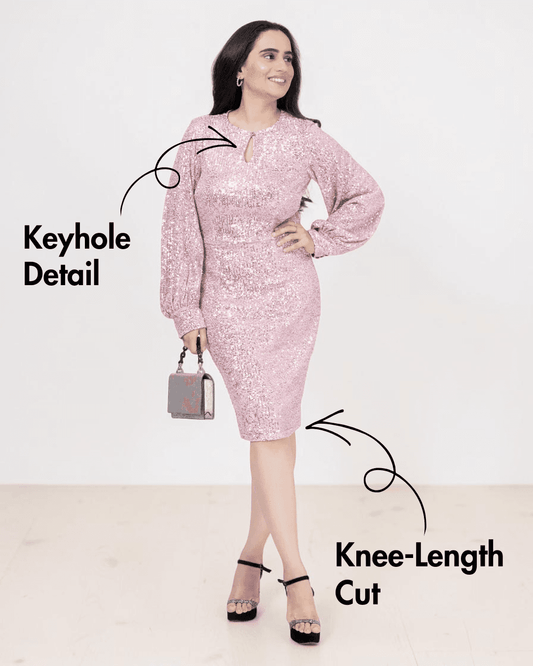 Model wearing pink sequin sheath dress with knee-length cut and keyhole detail