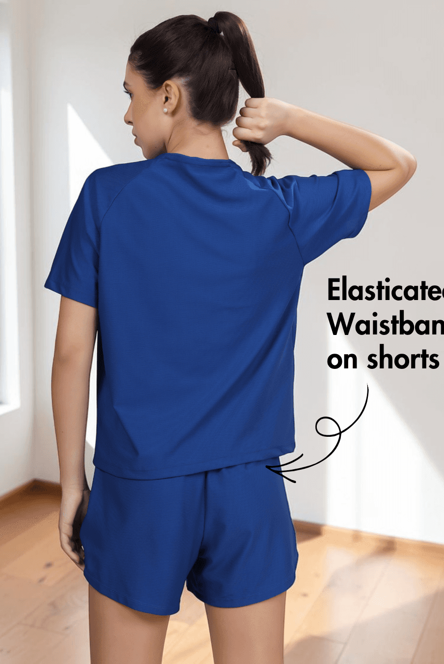 Back view of blue activewear set with elasticated waistband shorts