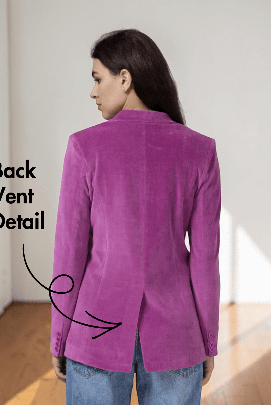 Back view of women's pink blazer highlighting back vent detail and tailored fit