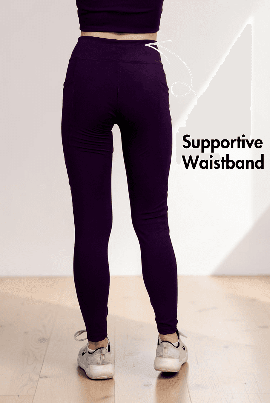 Model demonstrating high-waisted leggings with side pockets and full length