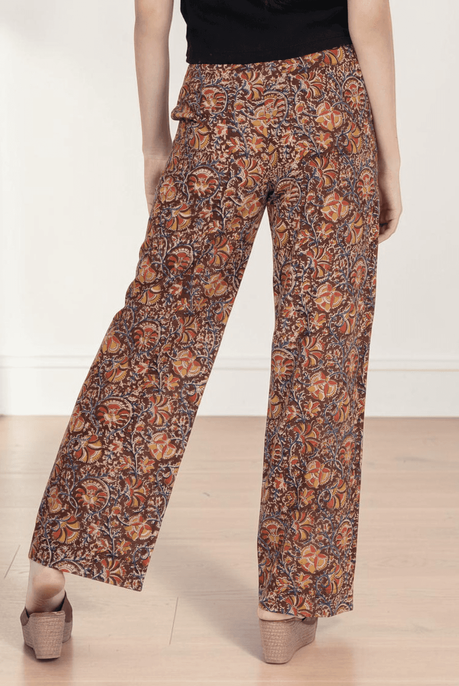 Close-up of patterned wide leg pants with high waist and structured waistband