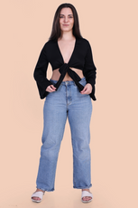 Front Pose Image of a model wearing a tie front crop top sewed with winslet's patterns paired with blue jeans