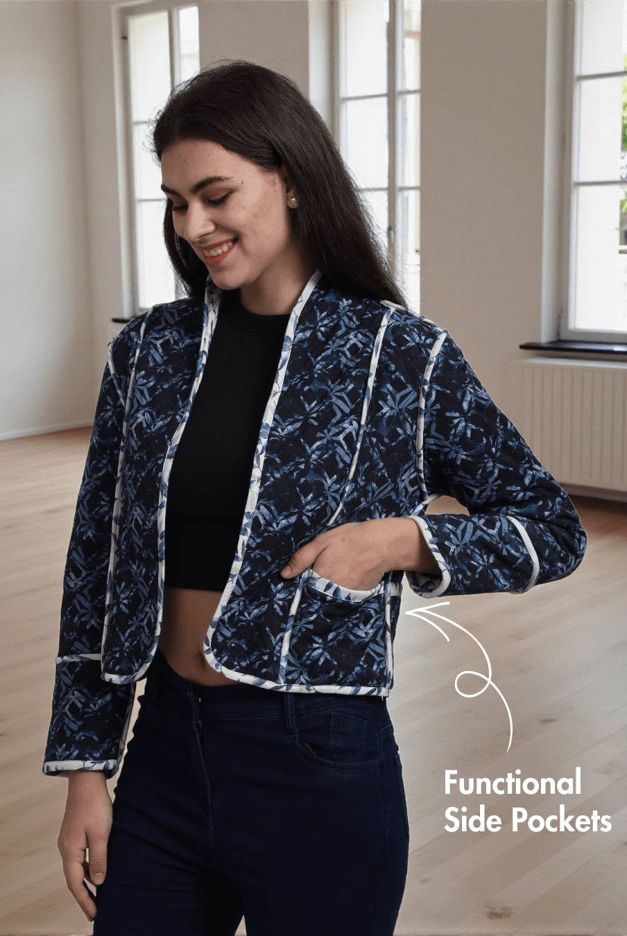 Model wearing Romy reversible jacket in dark blue print with functional side pockets and contrast binding, a cozy and stylish DIY outerwear option.