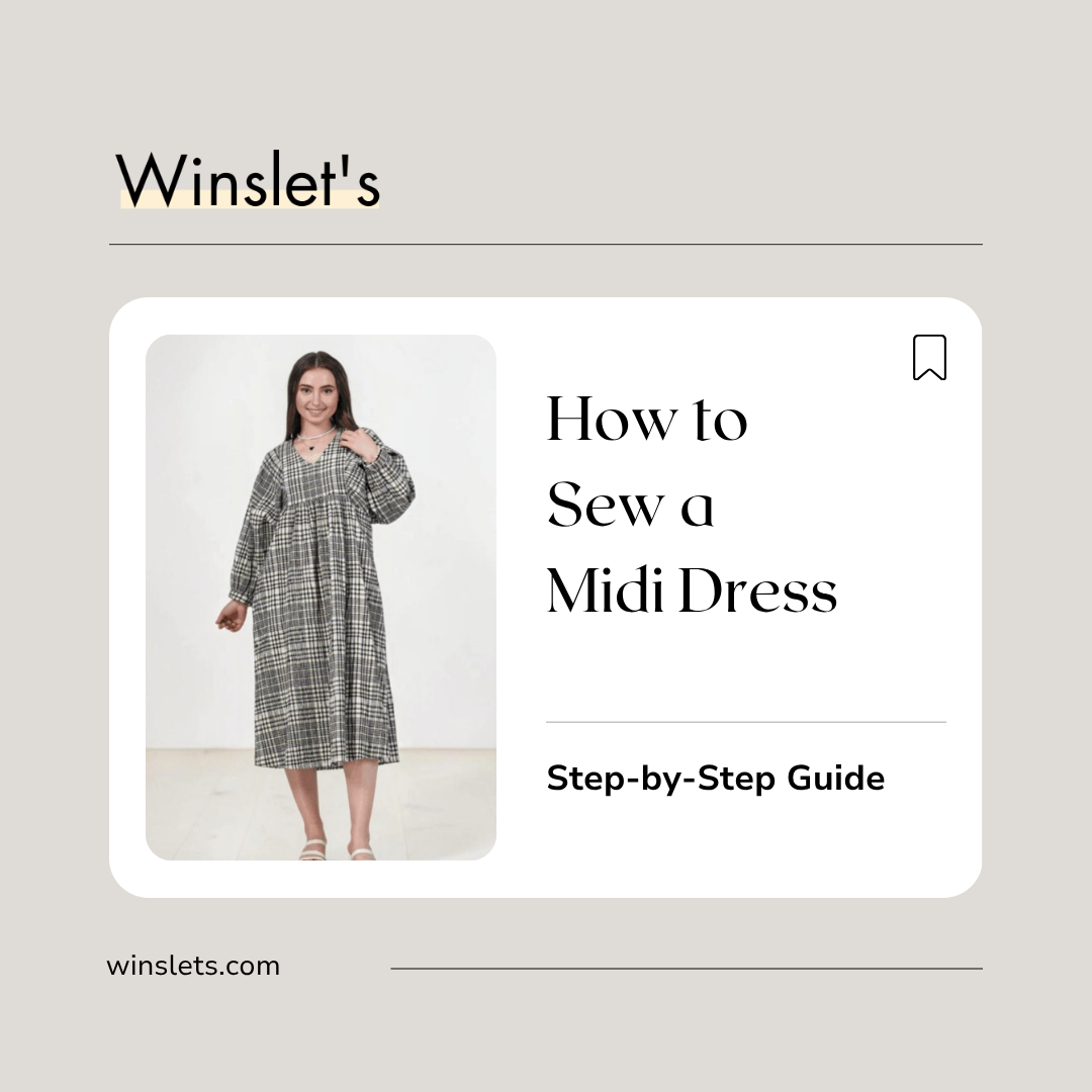 Woman wearing the Winslet's Heather Midi Dress sewing pattern, a relaxed midi-length dress with long gathered sleeves, V-neckline, side pockets, and a comfortable loose-fitting silhouette sewn in cotton seersucker fabric.