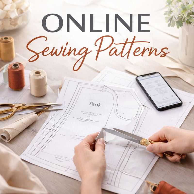 Hands cutting fabric over downloadable online sewing patterns.