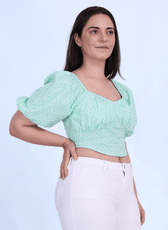Side view of the Blossom Bustier Crop Top showcasing puff sleeves and a fitted waist. Perfect for creating a trendy and flattering handmade top.