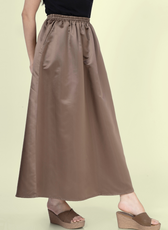 Side view of the gathered skirt from the 'Zinnia' sewing pattern, showcasing the elegant drape and comfortable elastic waistband.