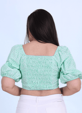 Back view of the Blossom Bustier Crop Top featuring a smocked panel for a comfortable fit. A fashionable and easy-to-sew pattern for DIY enthusiasts.