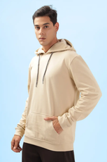 Front view of a beige men's hoodie from the 'Atlas' sewing pattern. Displays a casual fit with ribbed cuffs, hem, and a spacious kangaroo pocket.