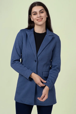 Close-up of the 'Camille' straight-cut coat sewing pattern. The tailored design includes a single-breasted closure, structured shoulders, and flap pockets.