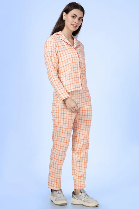 Model wearing the 'Pebble' pajama set in a checkered pattern, showcasing the relaxed fit. Beginner-friendly sewing pattern with A0, A4, and projector files.