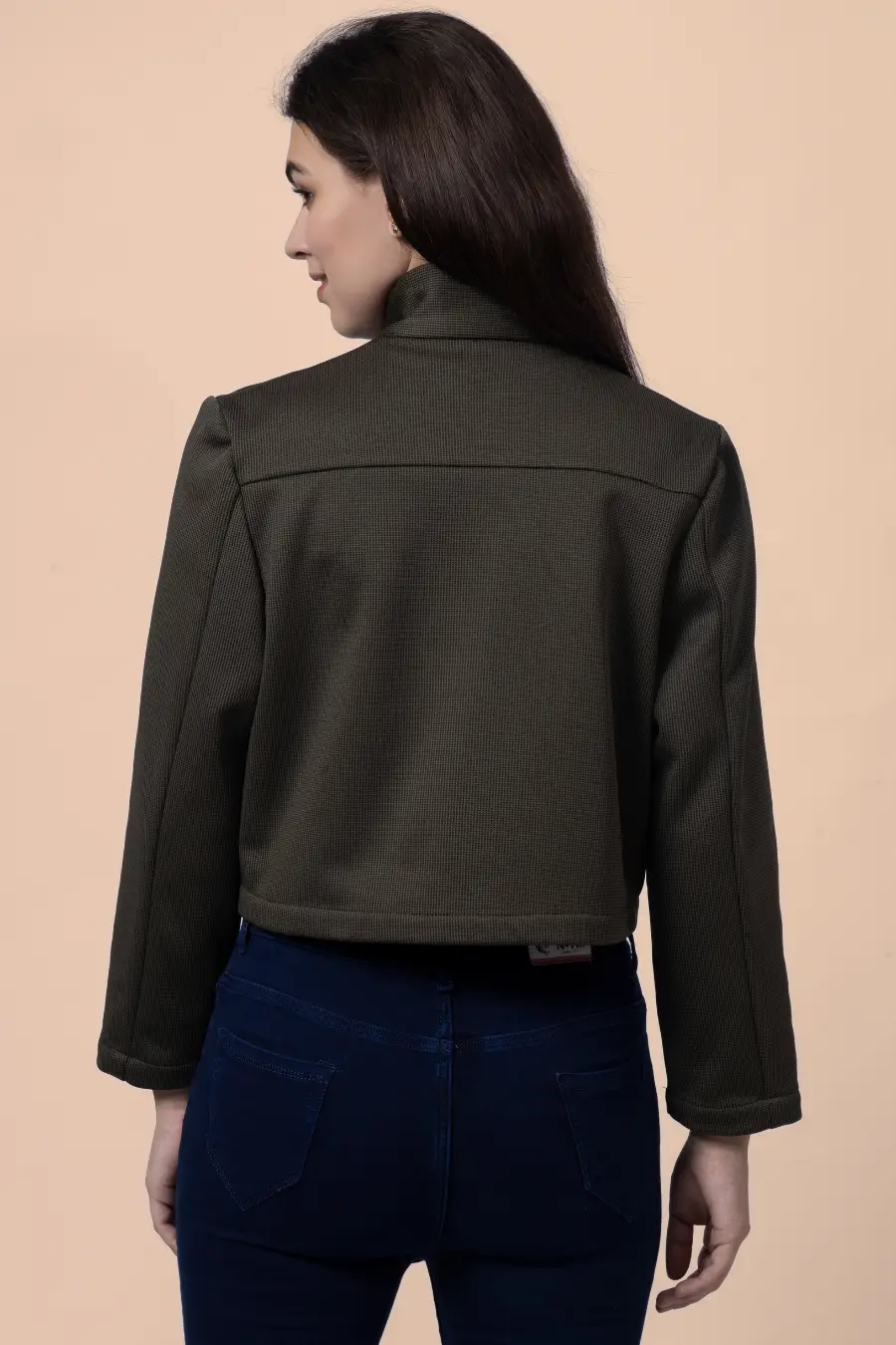 Back view of the 'Noelle' short jacket, showing its clean stitching, cropped hem, and structured fit for a modern look.