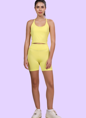 Front view of model wearing 'Nadia' biker shorts sewing pattern. High-waisted and form-fitting, perfect for gym and casual outfits.