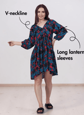 Woman wearing floral boho dress with V-neck and long lantern sleeves, sewing pattern 'Ivy'