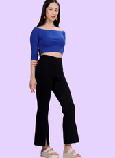 Model wearing high-waisted flared pants with front slits. DIY sewing pattern available in digital format for various paper sizes and projector use.