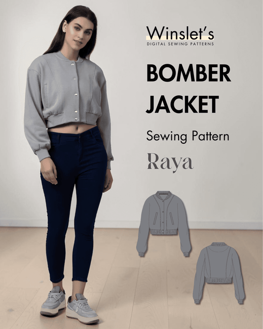 Gray bomber jacket with ribbed cuffs, waistband, round neck, and snap buttons, shown on a model