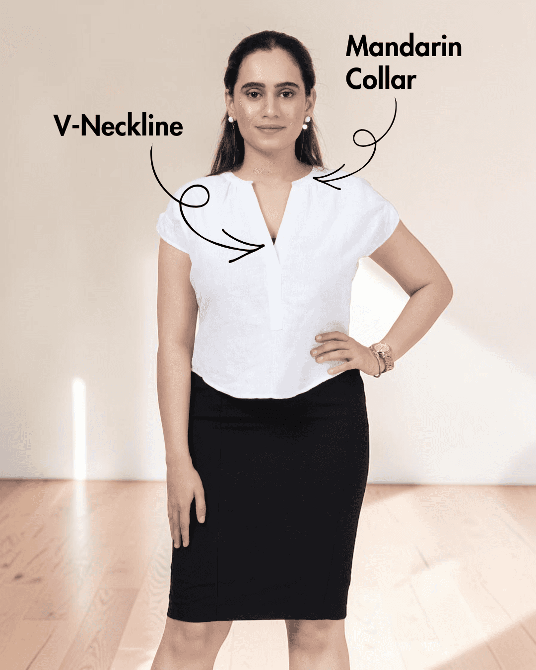 Front view of women's white short sleeve blouse sewing pattern with gathering at back