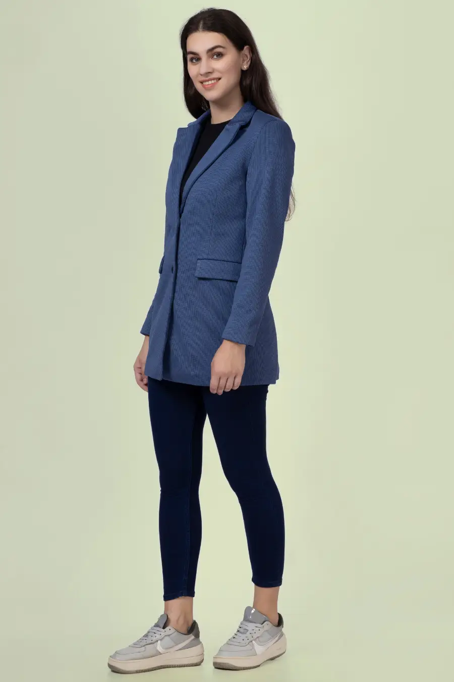 Side view of the 'Camille' straight-cut coat sewing pattern. The structured coat features a tailored fit, single-breasted closure, and notched lapel.