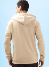 Back view of a beige men's hoodie from the 'Atlas' sewing pattern. Features a relaxed fit with a hood and ribbed hem for a comfortable wear.