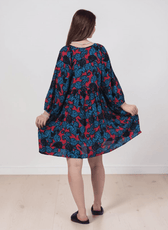 Boho dress with floral pattern, long sleeves, knee length, relaxed fit, back view